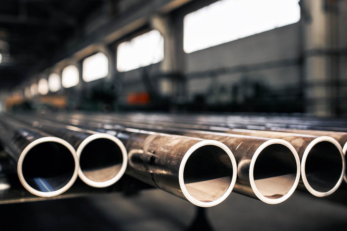 Metallic Pipes On Warehouse, Rows Of Metal Pipes On Industrial Warehouse. Industrial Interior,