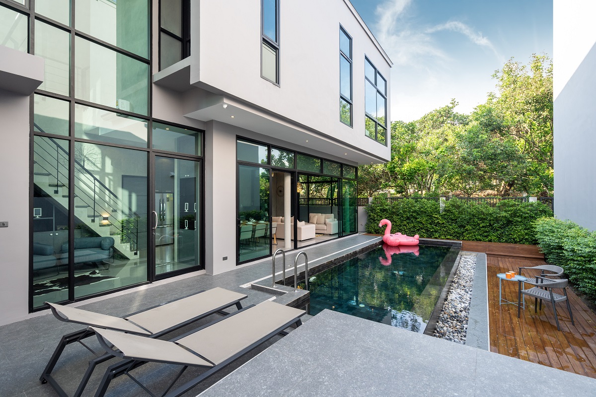 Pool Terrace And Pink Floating Duck In Infinity Swimming Pool