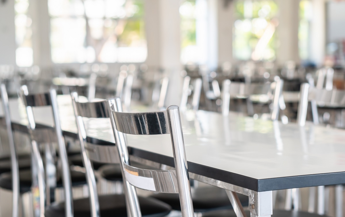 Stainless Steel Tables And Chairs In High School Student Canteen